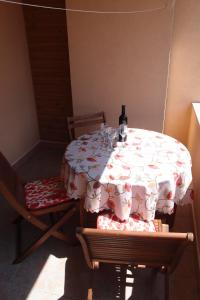 a table with a table cloth with wine glasses on it at Villa Lina in Ičići