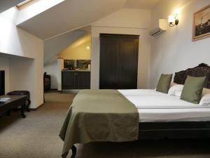 En eller flere senge i et værelse på Sibiu City Center Apartments