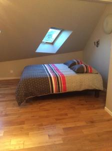 Postel nebo postele na pokoji v ubytování Gîte Le Faucon Pèlerin