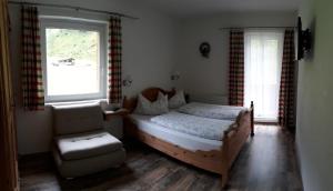 Postel nebo postele na pokoji v ubytování Ferienwohnung Alpklang