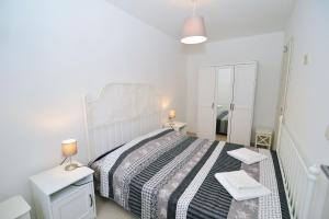 Postel nebo postele na pokoji v ubytování Apartments Knezgrad