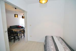 Postel nebo postele na pokoji v ubytování Apartments Knezgrad