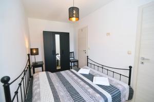 Postel nebo postele na pokoji v ubytování Apartments Knezgrad