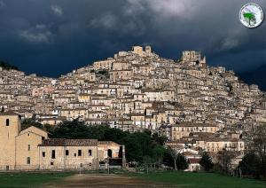 a town on the side of a mountain at Il Nibbio - Casa dell'artista in Morano Calabro