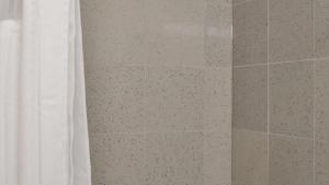 a bathroom with a shower with a shower curtain at America's Best Value Inn - Memphis Airport in Memphis