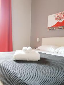 Postel nebo postele na pokoji v ubytování Solfatara Suites B&B
