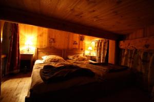 Postel nebo postele na pokoji v ubytování Appartement duplex de charme hyper centre à Val d'Isère