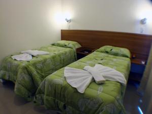 Ein Bett oder Betten in einem Zimmer der Unterkunft Pousada Omnimare