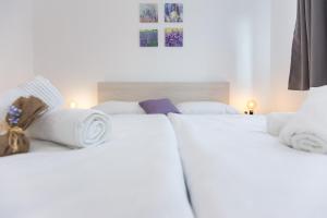 Postel nebo postele na pokoji v ubytování Apartments Kiara