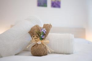 Postel nebo postele na pokoji v ubytování Apartments Kiara