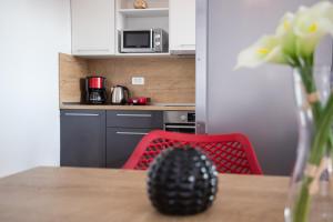 Kuchyň nebo kuchyňský kout v ubytování Apartments Kiara