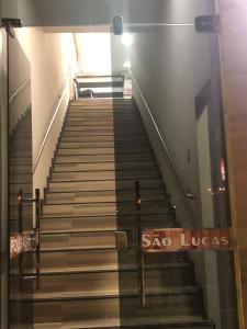 a staircase with a sign that says sao luce at Pousada São Lucas in Salgueiro