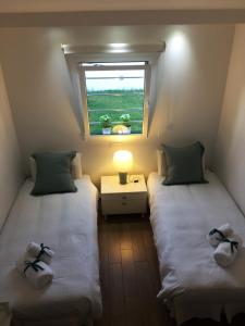 Posteľ alebo postele v izbe v ubytovaní Bungalow ACK