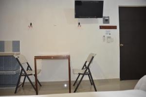 TV a/nebo společenská místnost v ubytování Casa Mahahual