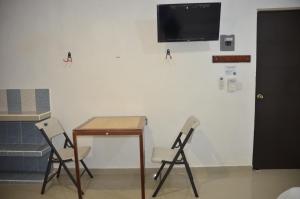 TV a/nebo společenská místnost v ubytování Casa Mahahual