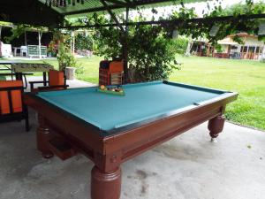 a pool table sitting in a yard next to a park at Finca El Recreo - El Descanso in Montenegro