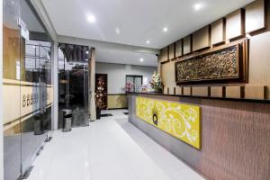 a lobby of a building with a reception desk at RedDoorz Plus @ Tuparev Cirebon in Cirebon