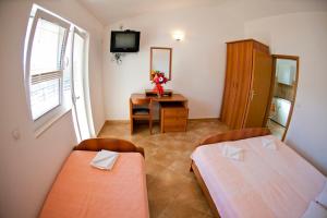 Postel nebo postele na pokoji v ubytování Apartments Stanka