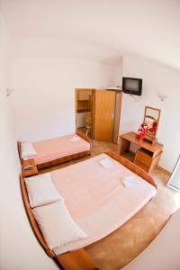 Postel nebo postele na pokoji v ubytování Apartments Stanka