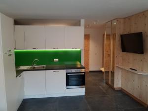 Kuchyň nebo kuchyňský kout v ubytování Didi`s Appartments + 5 fotografií