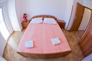 Postel nebo postele na pokoji v ubytování Apartments Stanka