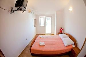 Postel nebo postele na pokoji v ubytování Apartments Stanka