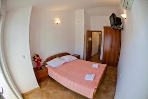 Postel nebo postele na pokoji v ubytování Apartments Stanka