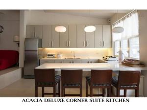 Kuchyň nebo kuchyňský kout v ubytování Agreeable Family Baguio Suites