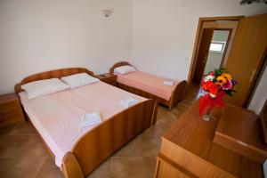 Postel nebo postele na pokoji v ubytování Apartments Stanka