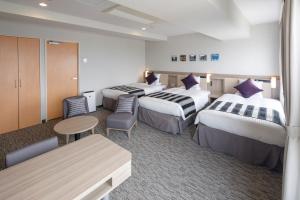 Tempat tidur dalam kamar di HOTEL MYSTAYS Hakodate Goryokaku +37 foto