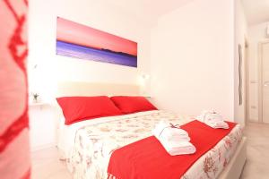 Letto o letti in una camera di Rosso di Mare Alghero