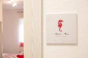 Letto o letti in una camera di Rosso di Mare Alghero