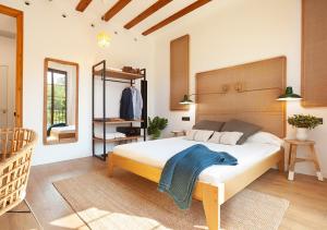 a bedroom with a large bed and a large window at Casa Vaganto in Barcelona
