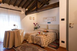 Posteľ alebo postele v izbe v ubytovaní Palazzo Loup Hotel
