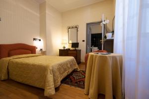 Posteľ alebo postele v izbe v ubytovaní Palazzo Loup Hotel