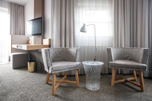 Televízia a/alebo spoločenská miestnosť v ubytovaní Hotel Jakob