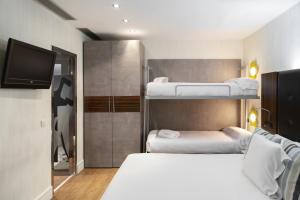 Кровать или кровати в номере Petit Palace Tamarises