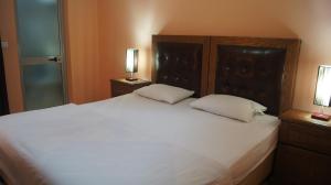Krevet ili kreveti u jedinici u okviru objekta Bristol Hotel Tirana