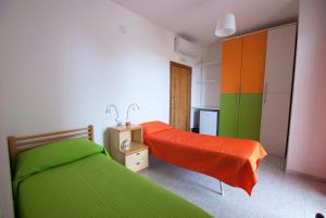 A bed or beds in a room at B&B Tra gli ulivi