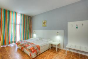 Postel nebo postele na pokoji v ubytování Hotel Erma