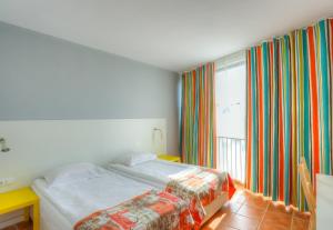 Postel nebo postele na pokoji v ubytování Hotel Erma