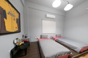 Postel nebo postele na pokoji v ubytování Happiness Pediatrics
