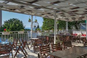 a group of tables and chairs on a patio at Hotel Erma in Golden Sands