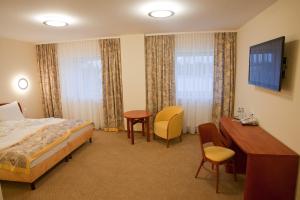 Postel nebo postele na pokoji v ubytování Hotel Rubin + 23 fotografií