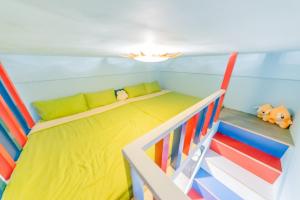 Postel nebo postele na pokoji v ubytování Happiness Pediatrics