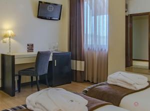 Cama ou camas em um quarto em Your Hotel & Spa Alcobaça
