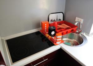 a small kitchen with a sink and a toy train next to it at Apartment Sarajka Center in Sarajevo