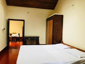 Postel nebo postele na pokoji v ubytování Shreegandha Homestay