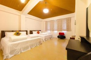 Postel nebo postele na pokoji v ubytování 雲庭民宿 Yunting B&B