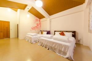 Postel nebo postele na pokoji v ubytování 雲庭民宿 Yunting B&B